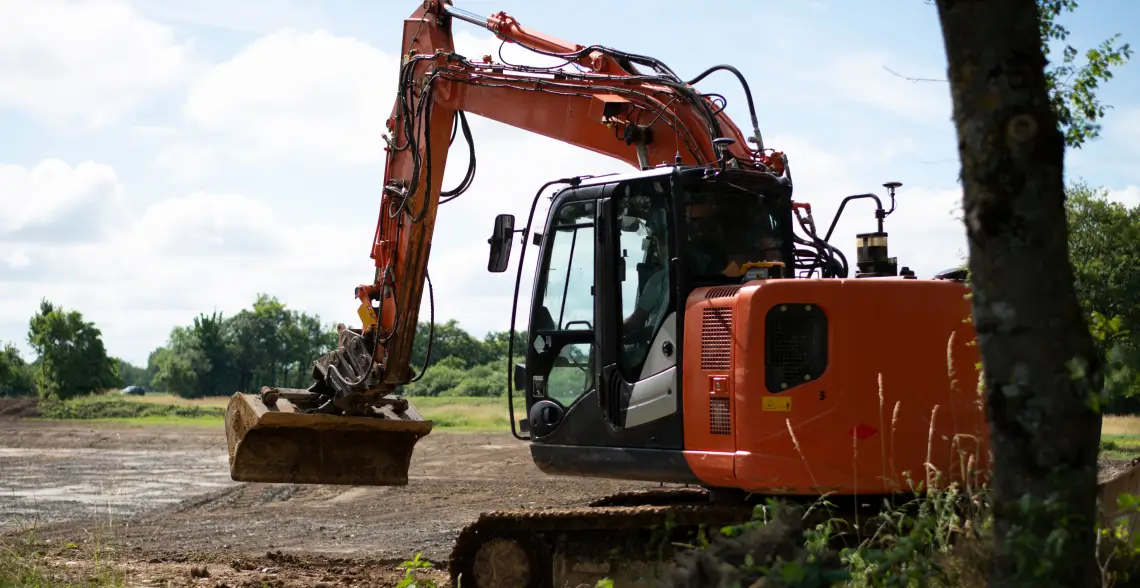 Image Shows a Hitachi Machine equipped with Komatsu's Smart Construction 3D Machine Guidance system